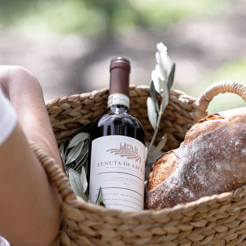 Tenuta di Arceno wine in basket with bread